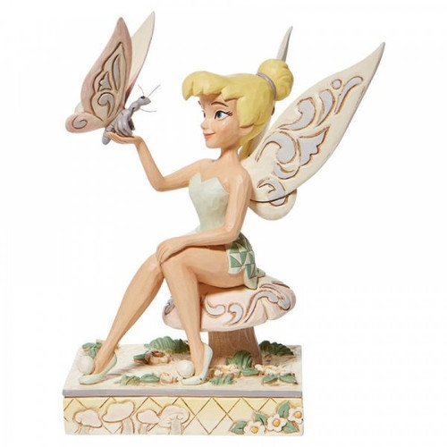Disney Traditions Tinker Bell, the fairy from Peter Pan sitting on a toadstool with a butterfly figurine