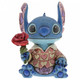 Disney Traditions Stitch the adorable alien from Lilo & Stitch wears a heart-patterned shirt as he offers a single red rose figurine