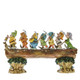 Disney Traditions All Seven Dwarfs from Snow White on a log figurine