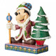 Disney Traditions Mickey Mouse dressed as Santa standing with staff in hand next to a Christmas Tree figurine