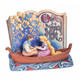 Disney Traditions Rapunzel and Flynn, from Tangled,  sit in a boat with lanterns overhead in a storybook figurine