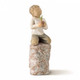 Willow Tree Something Special Figurine showing a child kneeling on a rock and holding a plant