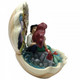 Disney Traditions The Little Mermaid, Ariel and Eric sit inside a clam shell with a scene from the film figurine