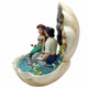 Disney Traditions The Little Mermaid, Ariel and Eric sit inside a clam shell with a scene from the film figurine
