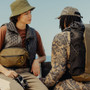 Peak Design Outdoor Sling 7L (Kelp) - Lora and James wearing the Outdoor Sling 7L Kelp and Outdoor Backpack 45L Kelp