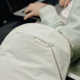 A close-up of a moon backpack with a small white brand tag | Peak Design official