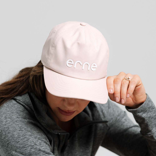 Front view of the erne Unstructured Poly 5 Panel Hat in the color Pink Clay on model.