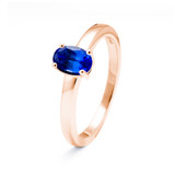 rose gold ring with oval cut blue sapphire gemstone