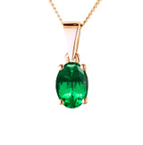 oval cut emerald gemstone in rose gold ashes pendant