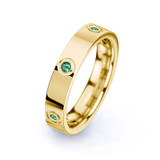 gold and emerald ashes ring