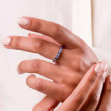 blue sapphire and diamond ashes eternity ring being worn