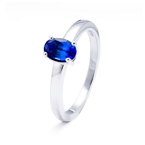 White gold memorial ring with oval blue sapphire stone