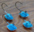 Underside view of four Orange and Blue Splash Erie Short Shank Jigs