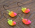 Underside view of four Lemon and Pink Splash Erie Short Shank Jigs
