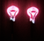 Pink / White Erie Stand Up Rattle Jigs showing glow effect