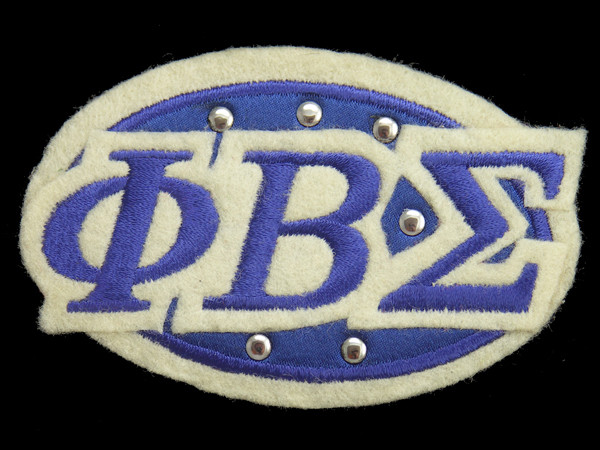 Sigma Felt Oval w/ Studs Emblem - 3  3/8"W