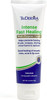 Applying TriDerma intense healing cream to dry cracked hands – non-greasy formula that soothes and restores damaged skin