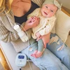 Lightweight portable breast pump fitting into the pocket of a sweatshirt for on-the-go mobility