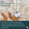 Hygienic closed system breast pump with protective barrier demonstrating clean tubing design