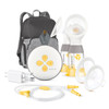 Medela Swing Maxi double electric breast pump with rechargeable battery and carry backpack on white background