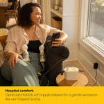 Mother using Medela Pump In Style Pro as double electric pump with compact portable unit