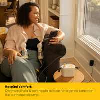 Mother using Medela Pump In Style Pro as double electric pump with compact portable unit