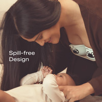 Mother using W1 with warming technology discreetly inside bra