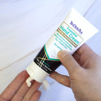 TriDerma hand cream being massaged into hands – dermatologist-tested formula safe for sensitive skin