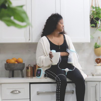 Zomee Z1 double electric breast pump in use – closed system technology prevents milk from entering tubes