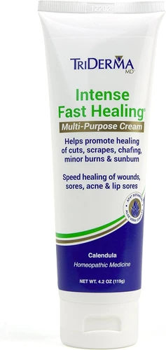 Applying TriDerma intense healing cream to dry cracked hands – non-greasy formula that soothes and restores damaged skin