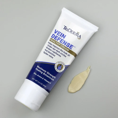Applying TriDerma Vein Defense cream to leg – non-greasy formula for visible veins and spider veins on body