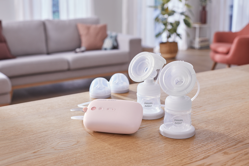 Complete Philips Avent pump kit including motor unit, two expression kits, two bottles, and sealing discs