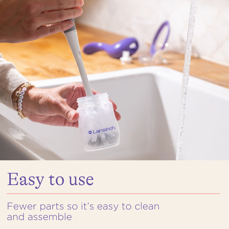 Mother using Lansinoh manual breast pump comfortably at home or while traveling