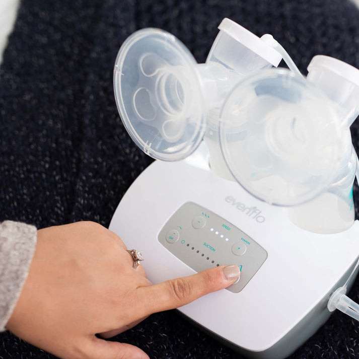 Mother using Evenflo Advanced double electric breast pump for efficient double pumping at home