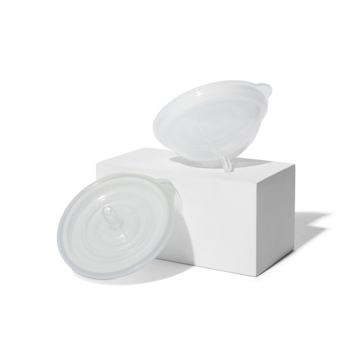 Complete milk collection set with containers, caps, discs, nipples, valves, connectors, and diaphragms