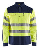 The BLAKLADER 3255 High Vis Yellow/Navy Blue Long Sleeve Shirt is designed for maximum visibility and safety in the workplace.