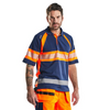 Stay comfortable and visible with the BLAKLADER 3338 Men's Navy Blue / High Vis Orange UV Protection Profile Polo Shirt.