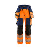 BLAKLADER 7022 High Vis Trouser Orange / Navy blue (Women) in Polyester with Holster Pockets and Kneepad Pockets – product display image; Application Hi-Vis, Holster Pockets true, Features 4-way stretch; Detachable tool pockets; CORDURA® reinforced…