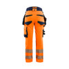 BLAKLADER 7022 High Vis Trouser Orange / Navy blue (Women) in Polyester with Holster Pockets and Kneepad Pockets – front view; Application Hi-Vis, Holster Pockets true, Features 4-way stretch; Detachable tool pockets; CORDURA® reinforced tool pocket…