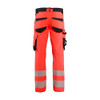 BLAKLADER 1124 High Vis Trouser Hi-Vis Red / Black (Men) in Polyester with Holster Pockets and Kneepad Pockets – front view; Holster Pockets true, Features 4-way stretch; CORDURA® reinforced knee pad pockets; Pre-bent legs; Reinforced pockets
