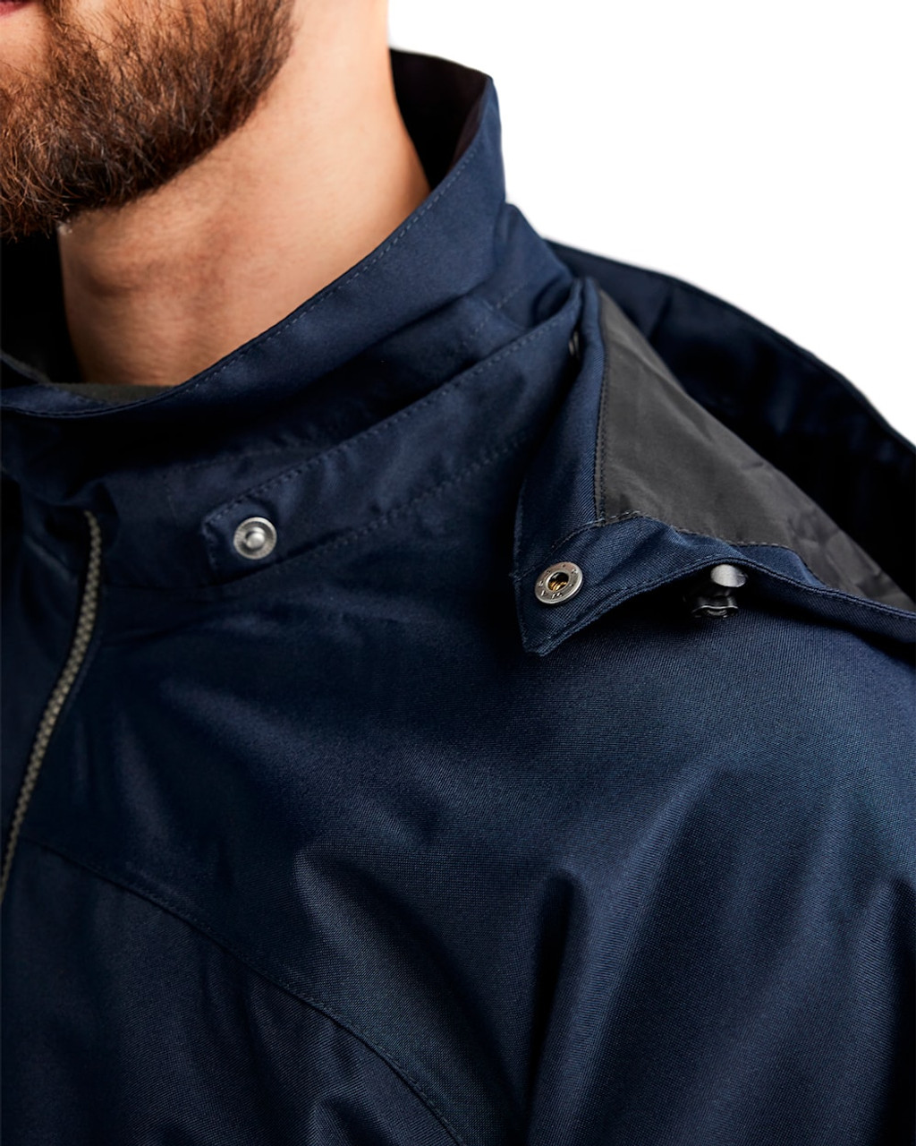 The Shell Blaklader Polyester jacket in Dark Navy Blue is perfect for layering over your work attire.