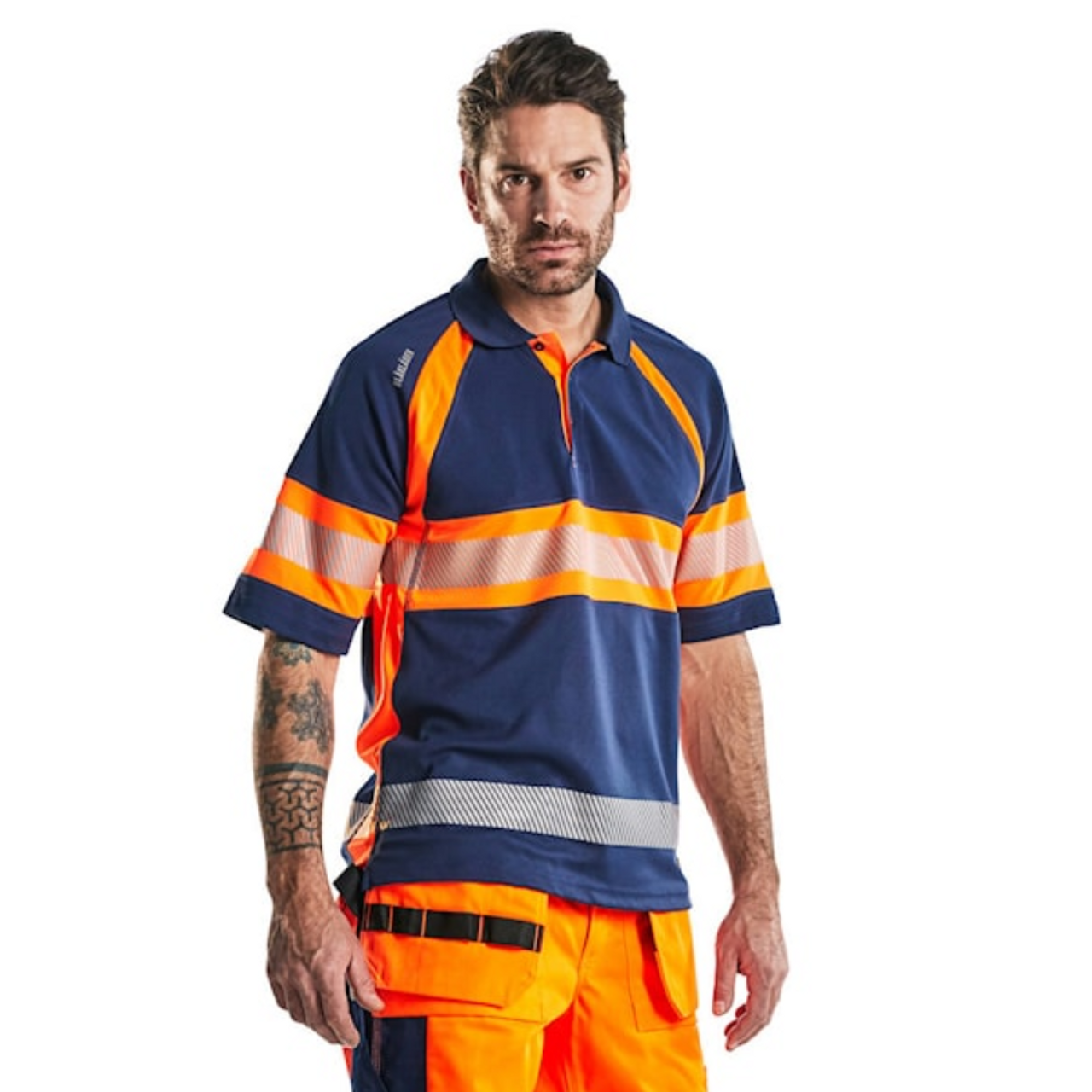 Stay comfortable and visible with the BLAKLADER 3338 Men's Navy Blue / High Vis Orange UV Protection Profile Polo Shirt.