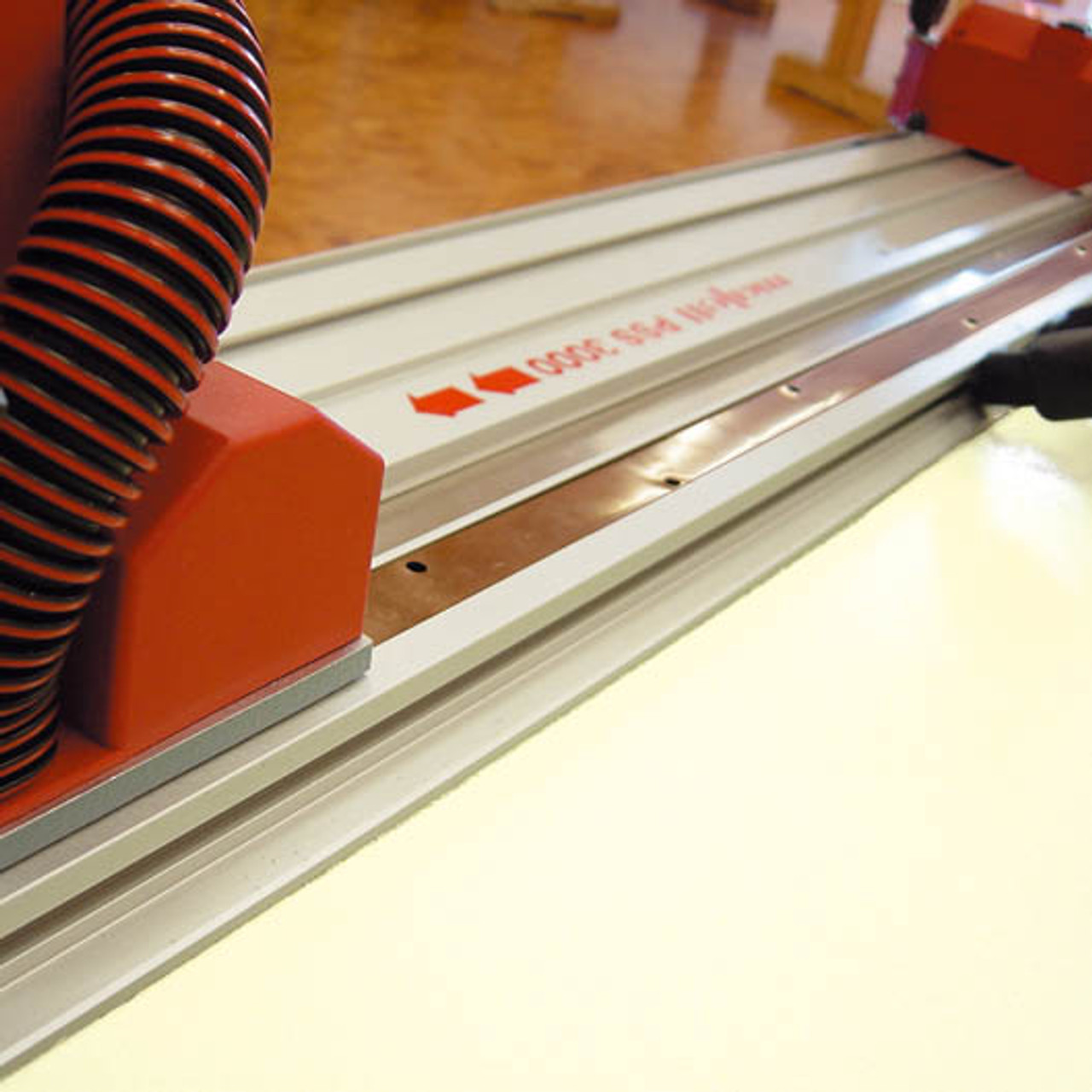 Rail-guided mobile panel saw features an integrated suction channel & vacuum system that effectively minimizes dust during operation.