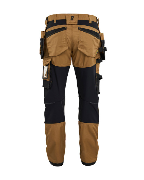 Whether on the job or off-duty, the BLAKLADER Trousers 1750 in Khaki Brown, featuring Holster Pockets, Kneepad Pockets, and made of Cotton with Stretch, keeps you moving freely.