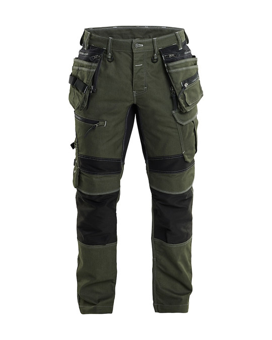 Need workwear that lasts? The BLAKLADER Craftsman Trousers 1990 in Green features Holster Pockets, Kneepad Pockets, and tough Denim with Stretch to handle any task.