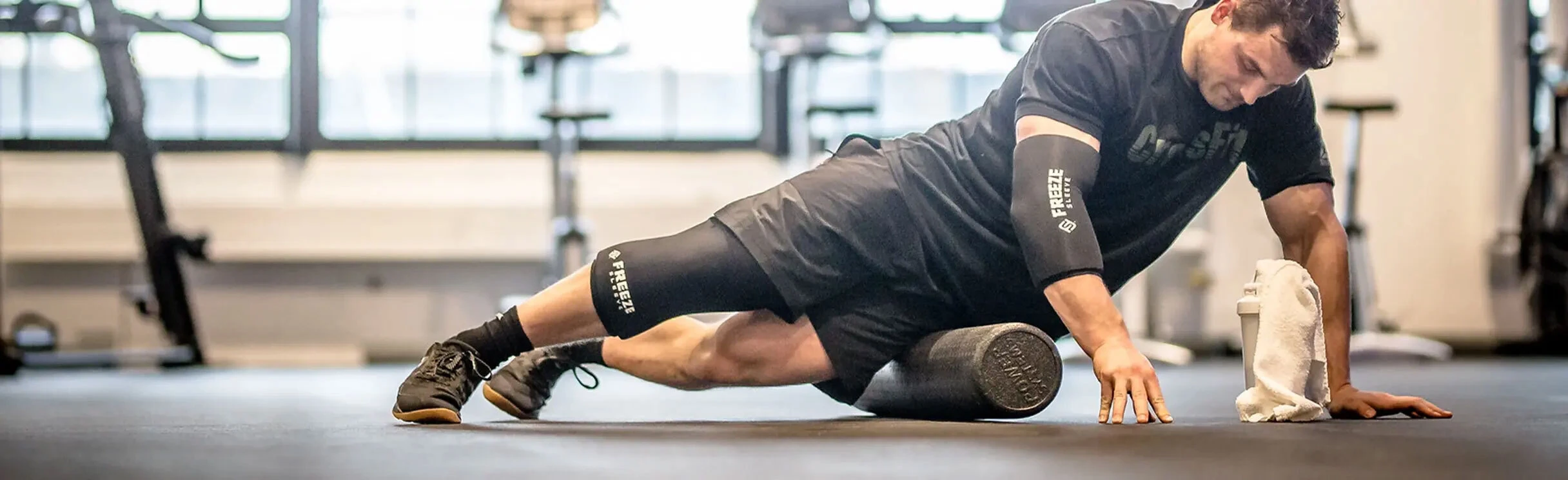 Athlete wearing a Freeze Sleeve on his knee and elbow.