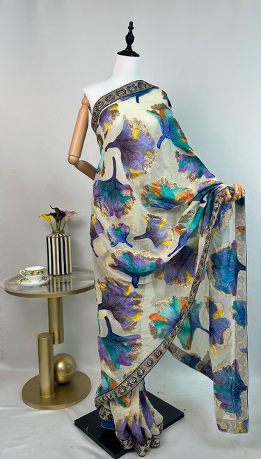 Spectacular Off-White French Silk Chiffon Saree with Multicolor Floral Motifs & Luxe Embroidered Border Spectacular Off-White French Silk Chiffon Saree with Multicolor Floral Motifs & Luxe Embroidered Border