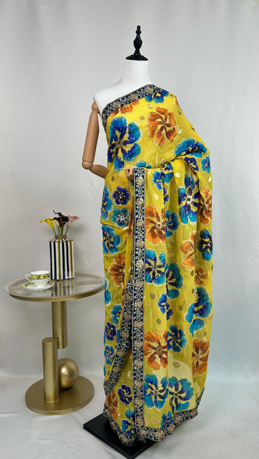 Sunshine Yellow Floral Printed Saree with Embroidered Blue Border Sunshine Yellow Floral Printed Saree with Embroidered Blue Border