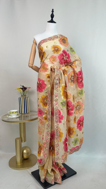 Luxe Cream Organza Saree with Grand Multicolor Floral Motifs & Intricate Embroidered Border Luxe Cream Organza Saree with Grand Multicolor Floral Motifs & Intricate Embroidered Border
