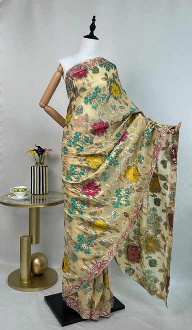 Classic Beige Organza Saree with Vibrant Floral Embroidery & Ornate Scalloped Border Classic Beige Organza Saree with Vibrant Floral Embroidery & Ornate Scalloped Border